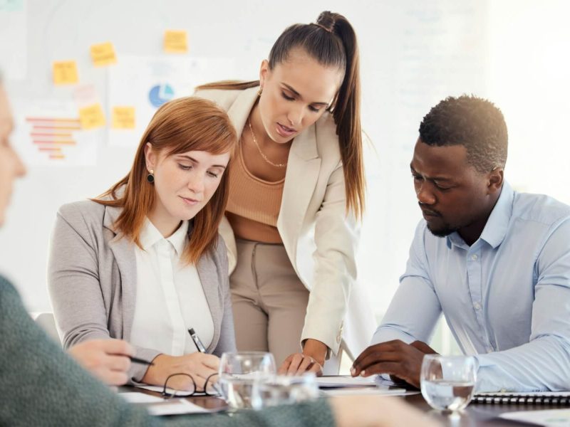 business-people-financial-and-meeting-at-a-table-with-serious-workers-planning-writing-and-prepar.jpg